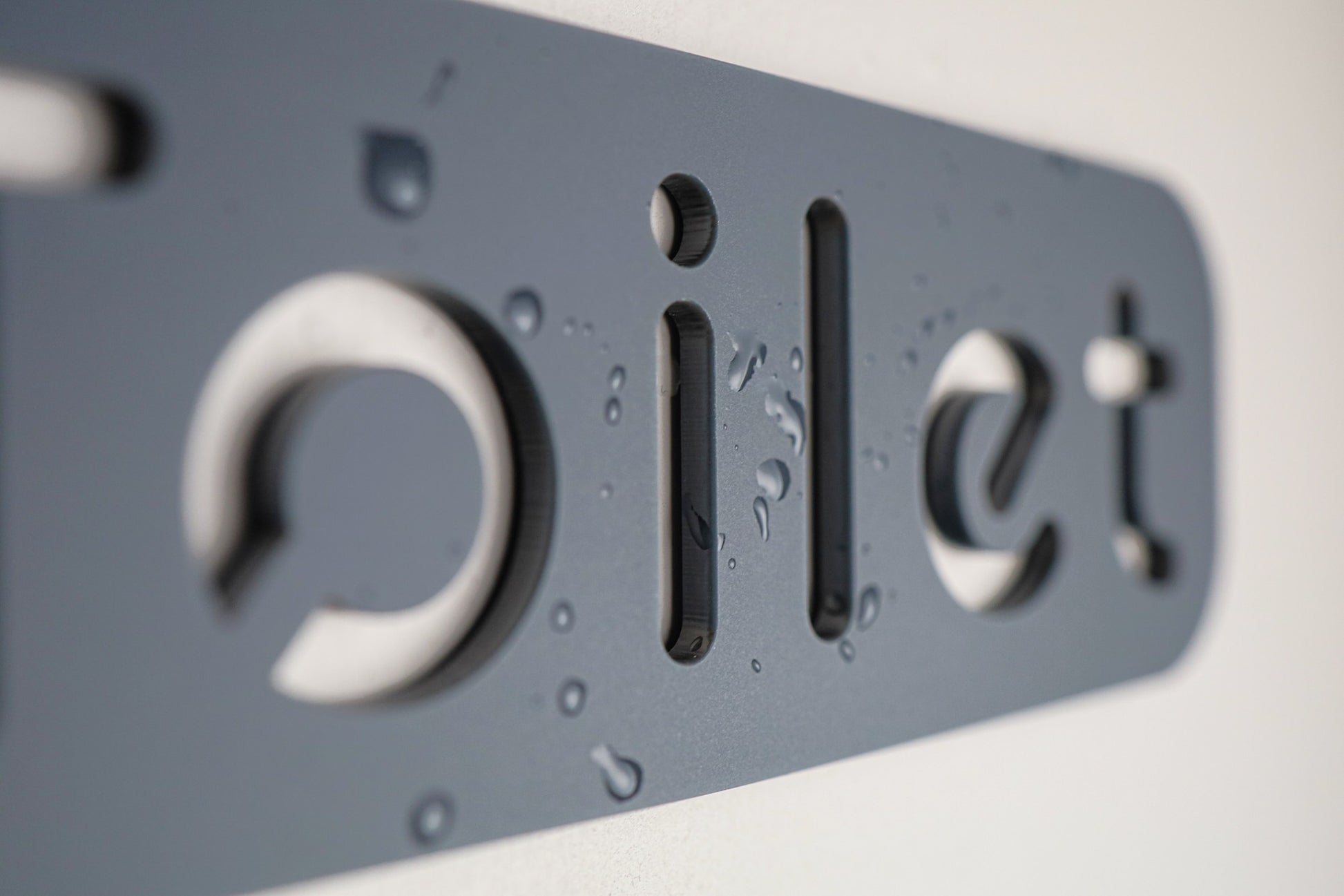 Waterproof toilet door sign made from durable acrylic with a sleek, modern design.