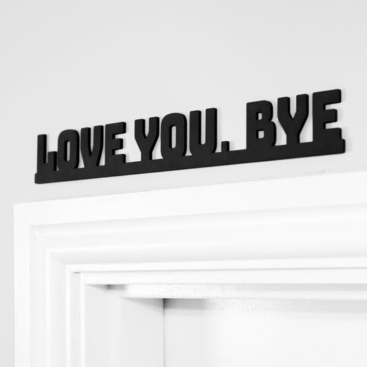 Love you bye sign used as a door topper