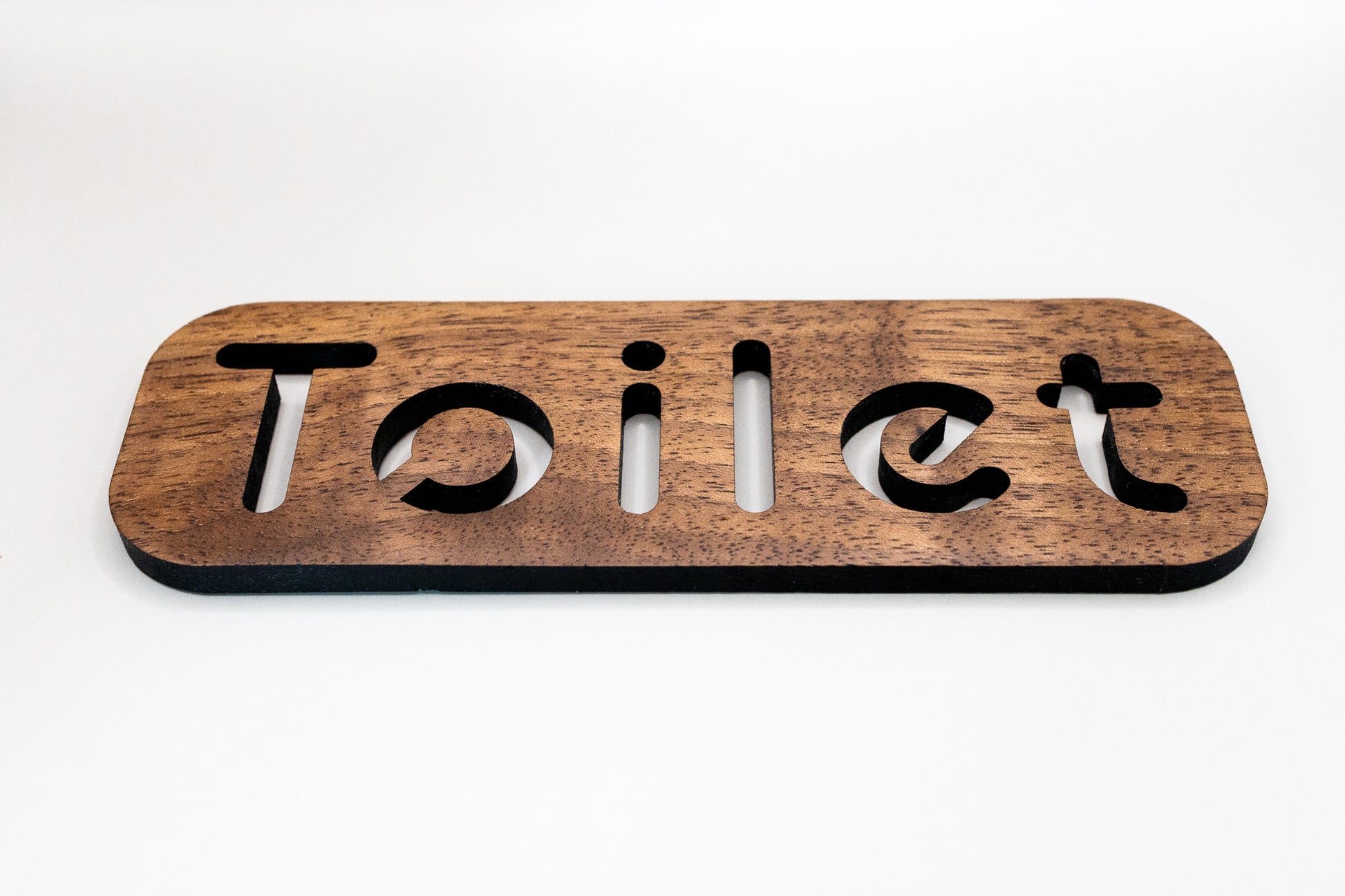 Toilet sign with adhesive tabs