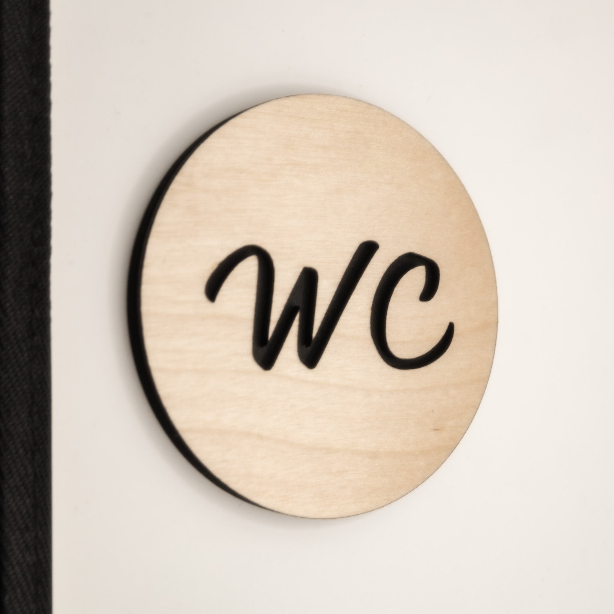 toilet door sign stuck on the wall