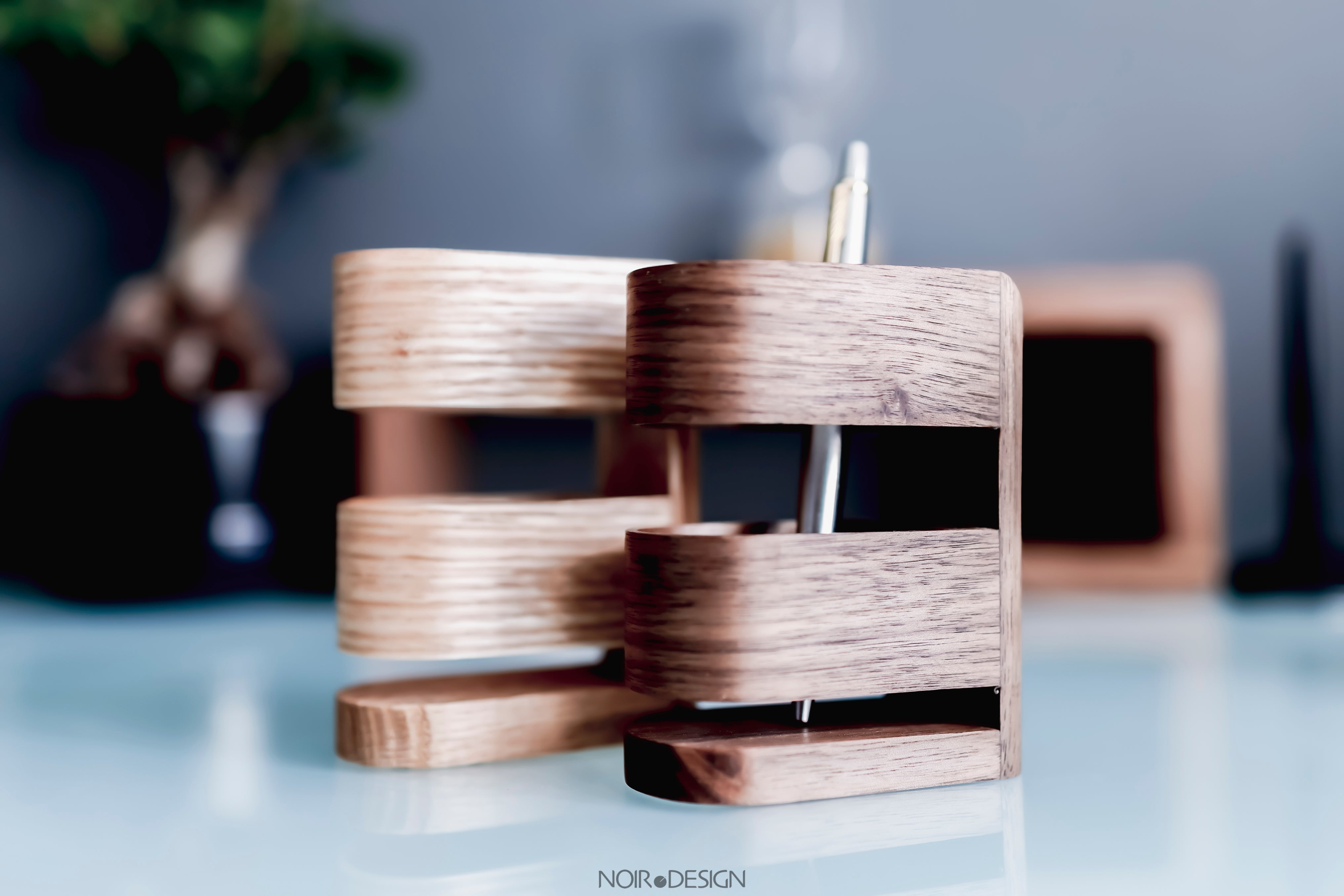 Luxury pen stand holder on a desk, perfect for protecting your expensive pens from wear and tear. Available in black walnut, oak, and ash.