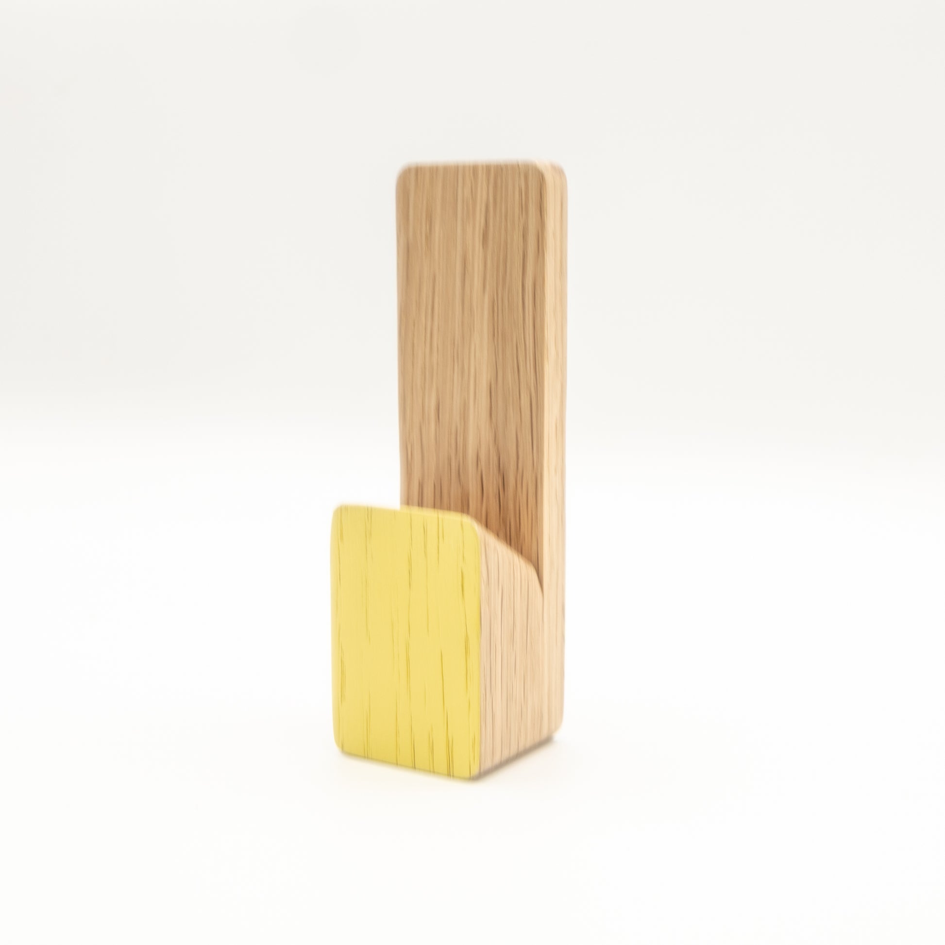 Wooden and yellow phone stand on a white background